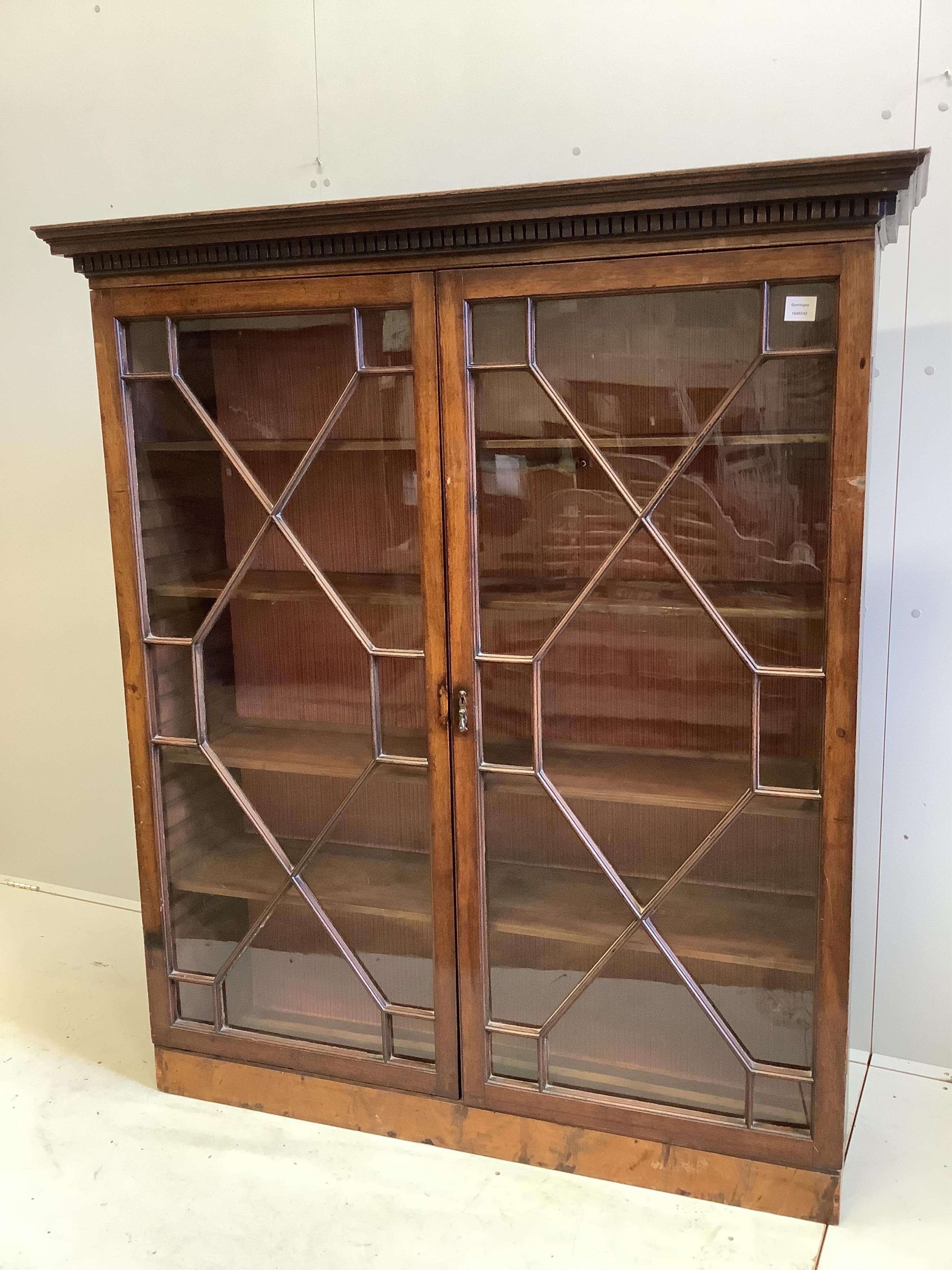 A George III style mahogany two door astragal glazed bookcase, adapted, width 137, depth 40cm, height 158cm. Condition - fair